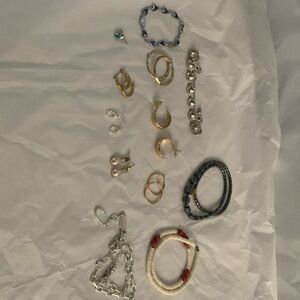 Two bracelets, three necklaces, seven pairs of earrings
